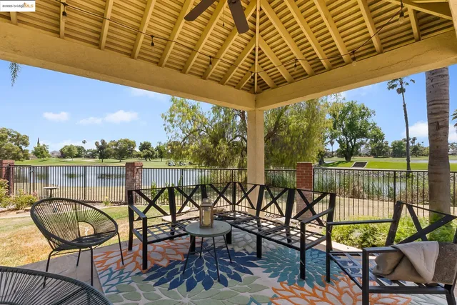 a view of a chairs and table in patio