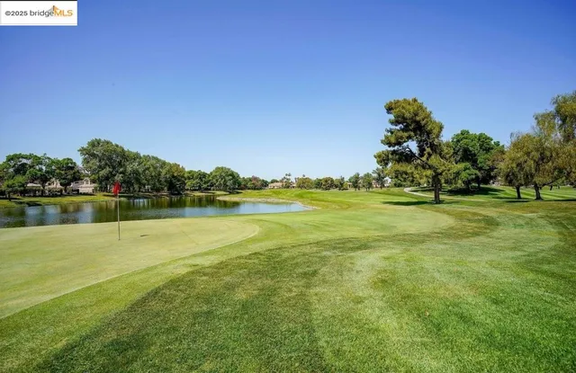 a view of a golf course with a lake