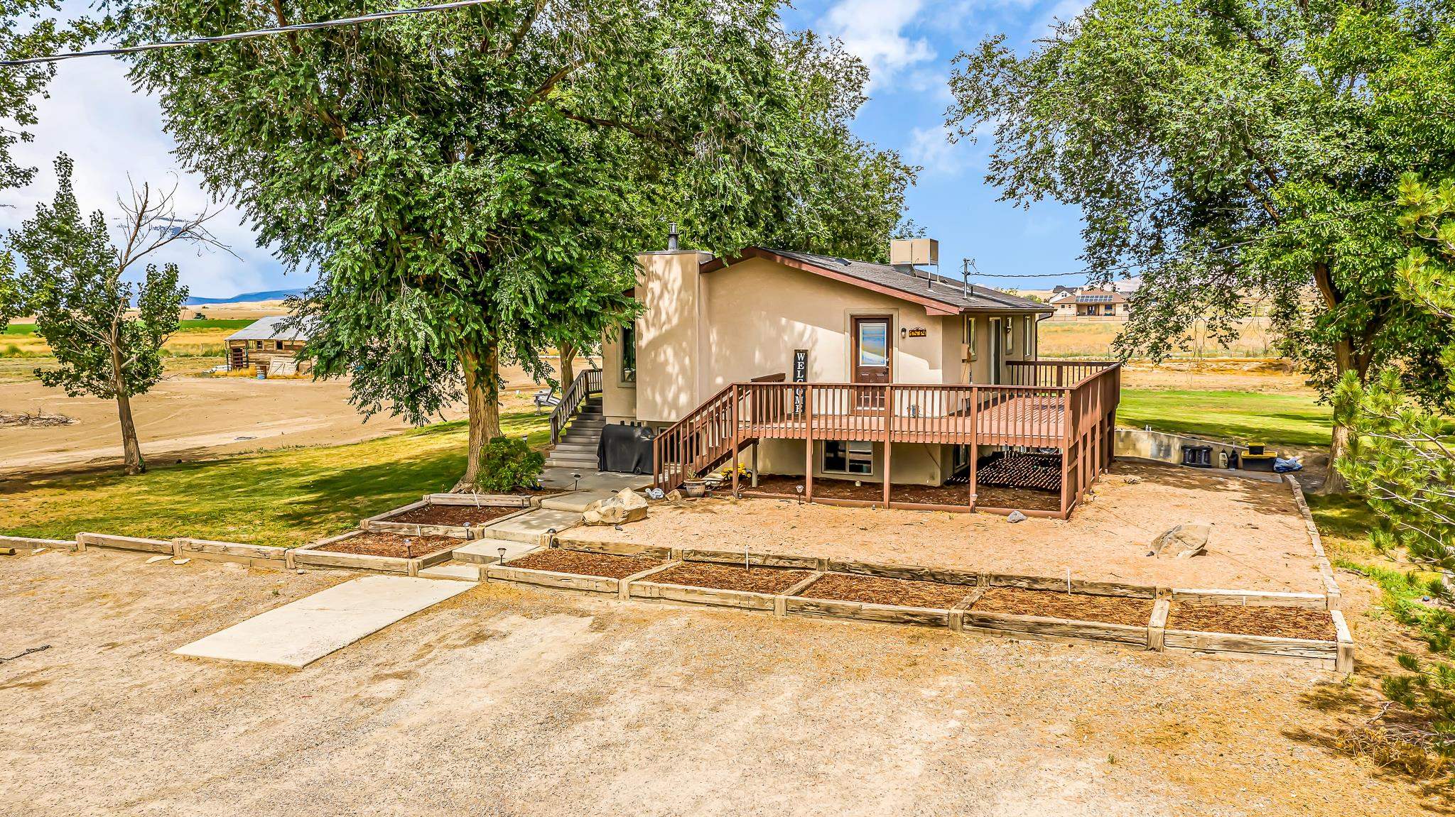 1574 P Road Loma, CO 81524 - Photo 7 of 34 a view of a house with a patio