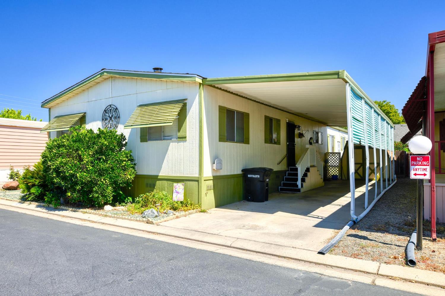 1200 South Carpenter Road, Unit 4 Modesto, CA 95351 - Photo 14 of 22 a front view of a house with a yard