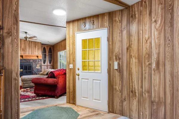 a bedroom with furniture and a large window