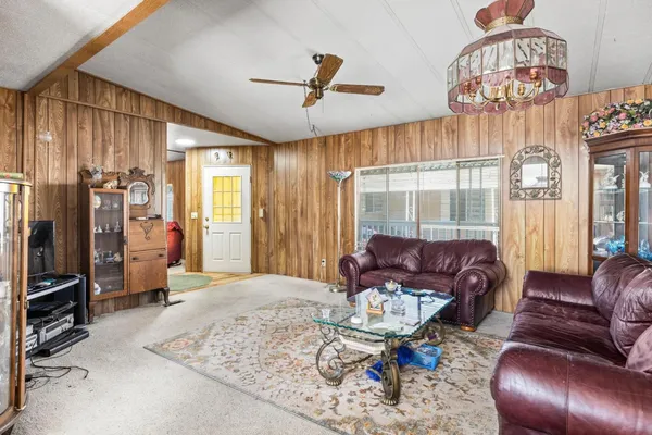 a view of a dining room with furniture and window