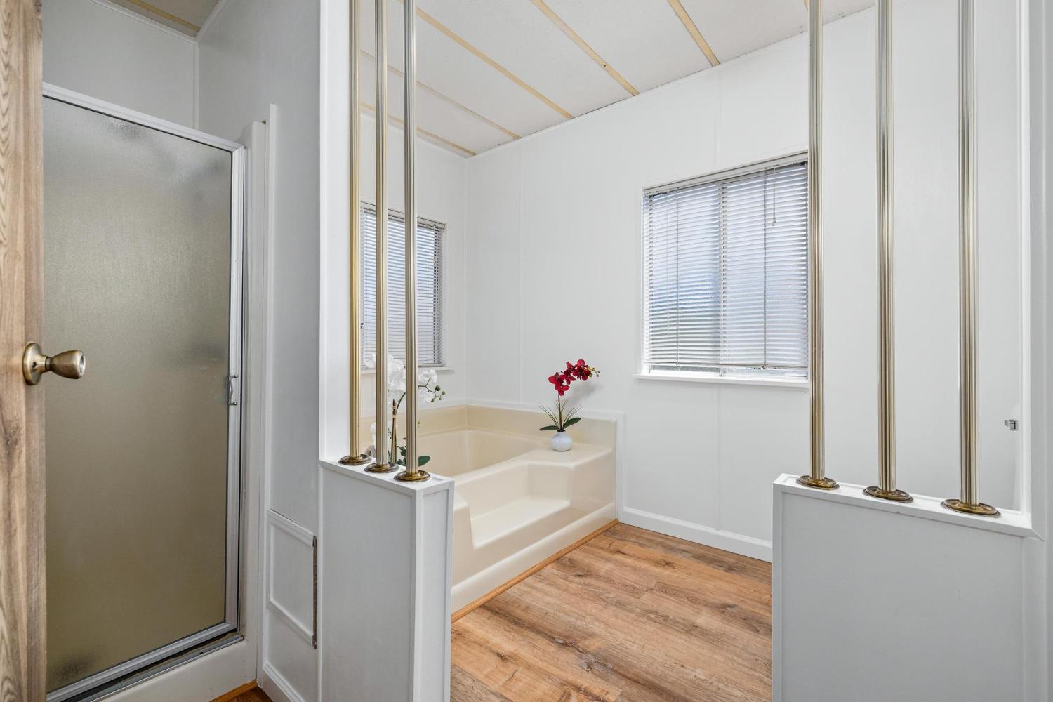 1200 South Carpenter Road, Unit 4 Modesto, CA 95351 - Photo 9 of 22 a bathroom with a tub and shower