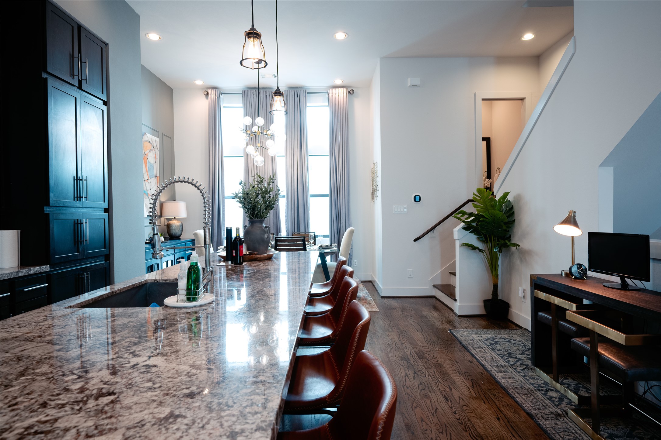2826 Clay Street Houston, TX 77003 - Photo 3 of 22 a living room with furniture a potted plant and a chandelier