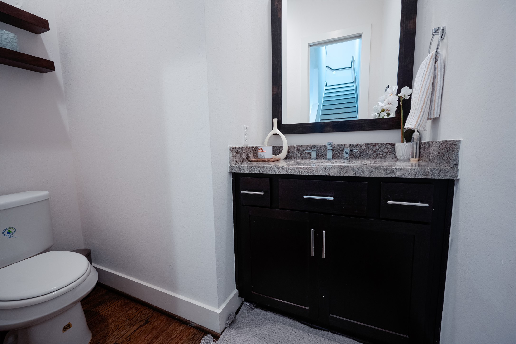 2826 Clay Street Houston, TX 77003 - Photo 8 of 22 a bathroom with a granite countertop toilet sink and mirror