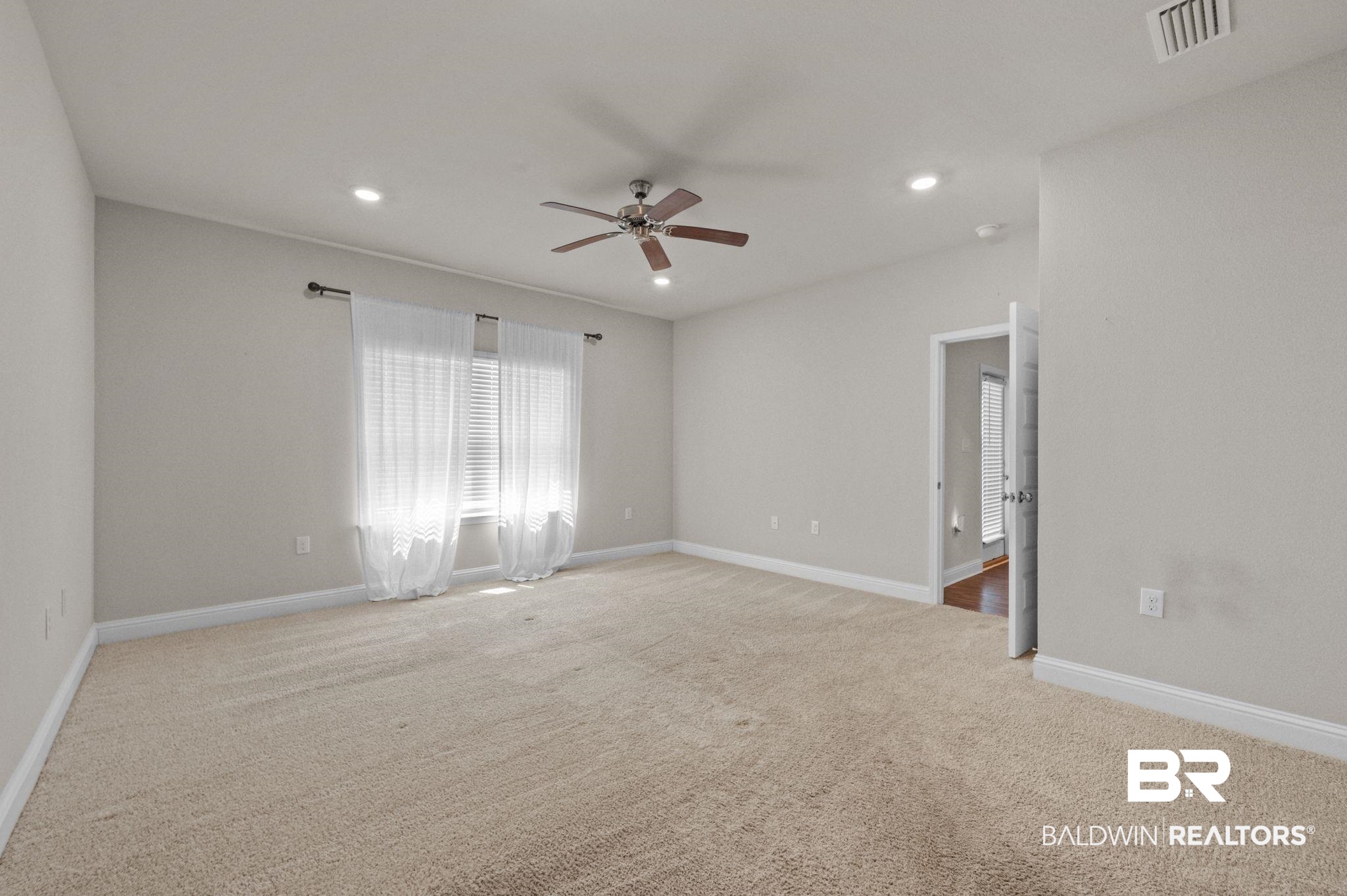24769 Slater Mill Road Daphne, AL 36526 - Photo 29 of 38 Carpeted spare room with ceiling fan