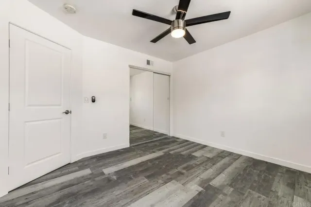 a bathroom with a sink mirror toilet and shower
