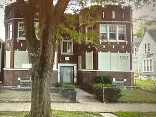 621 West 61st Place Chicago, IL 60621 - Photo 2 of 8 a front view of a house with a yard