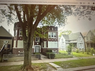 621 West 61st Place Chicago, IL 60621 - Photo 4 of 8 a front view of a house with garden