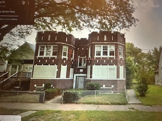 621 West 61st Place Chicago, IL 60621 - Photo 6 of 8 a front view of a house with garden