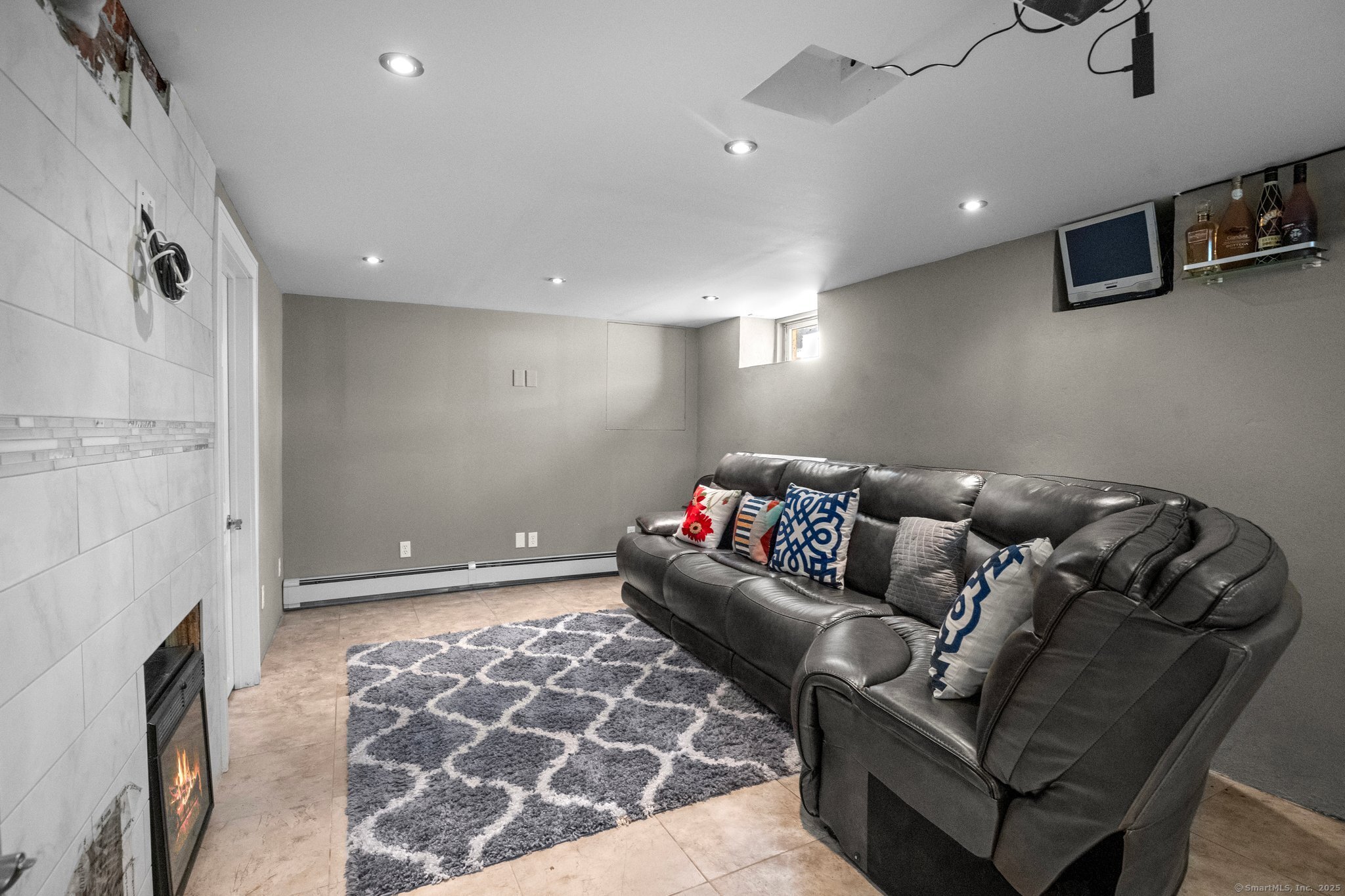 15 Overland Avenue Bridgeport, CT 06606 - Photo 13 of 35 a living room with furniture and a fireplace