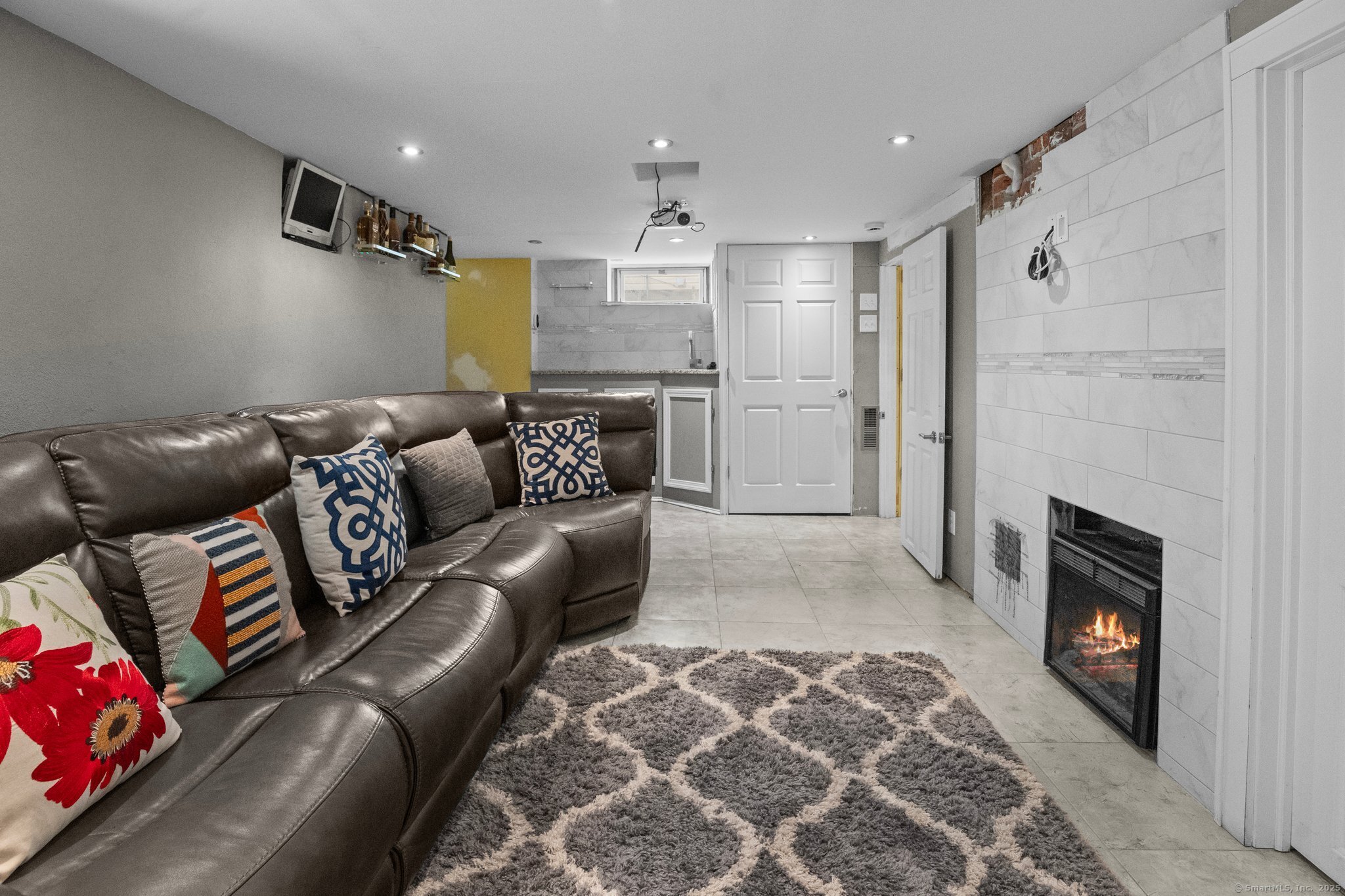 15 Overland Avenue Bridgeport, CT 06606 - Photo 14 of 35 a living room with furniture and a fireplace