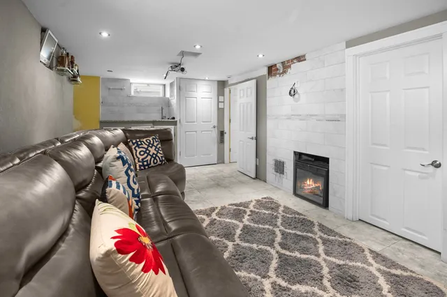 a view of a livingroom with furniture and a fireplace