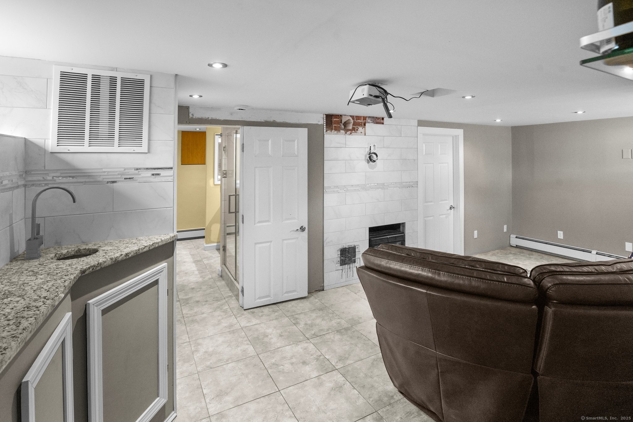 15 Overland Avenue Bridgeport, CT 06606 - Photo 16 of 35 a kitchen with granite countertop a sink and a refrigerator