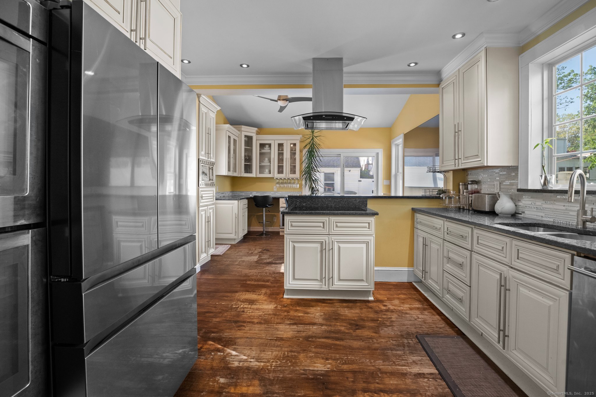 15 Overland Avenue Bridgeport, CT 06606 - Photo 24 of 35 a large kitchen with stainless steel appliances kitchen island granite countertop a refrigerator a stove and a sink