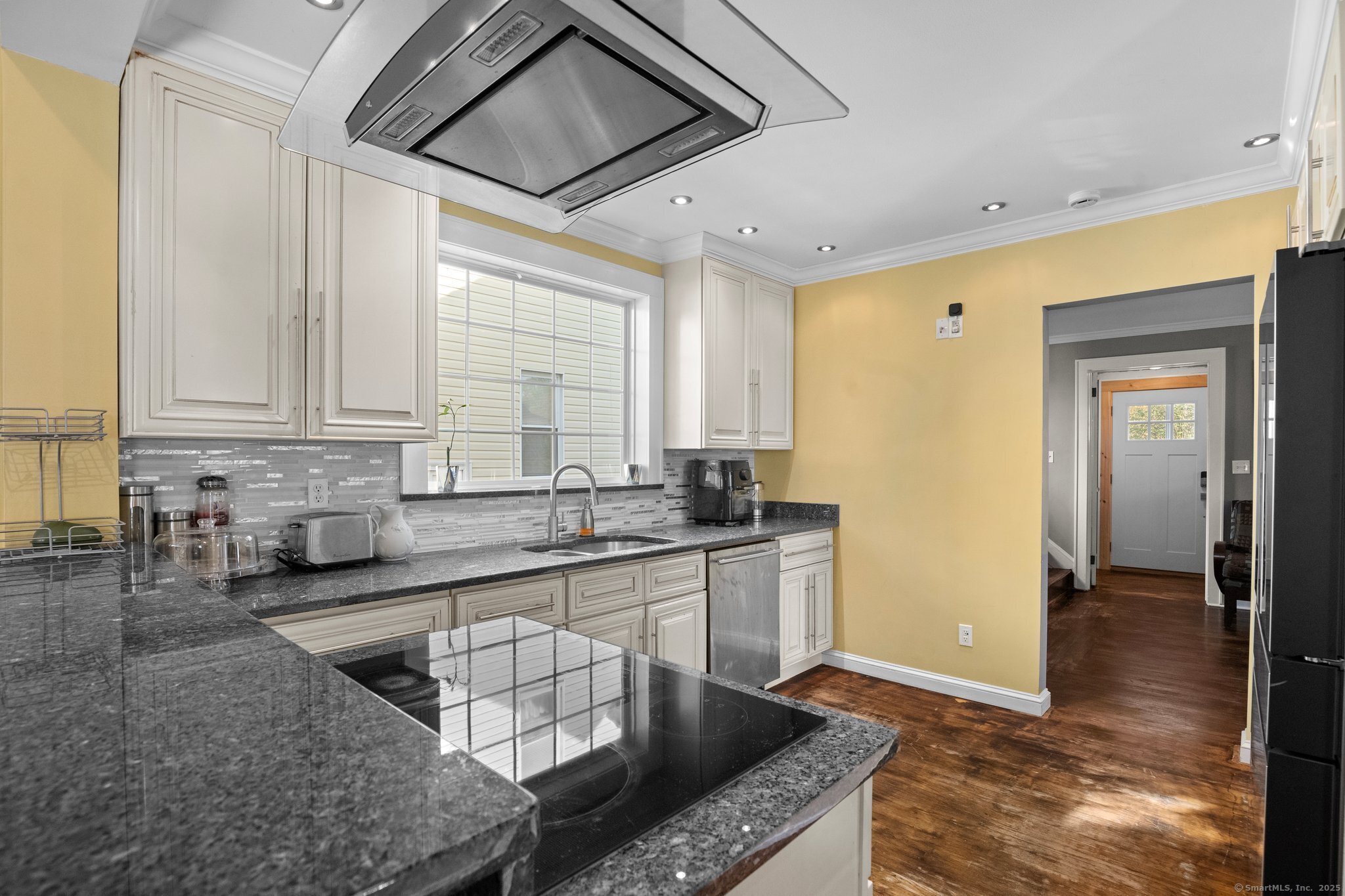 15 Overland Avenue Bridgeport, CT 06606 - Photo 28 of 35 a kitchen with stainless steel appliances granite countertop a sink and cabinets