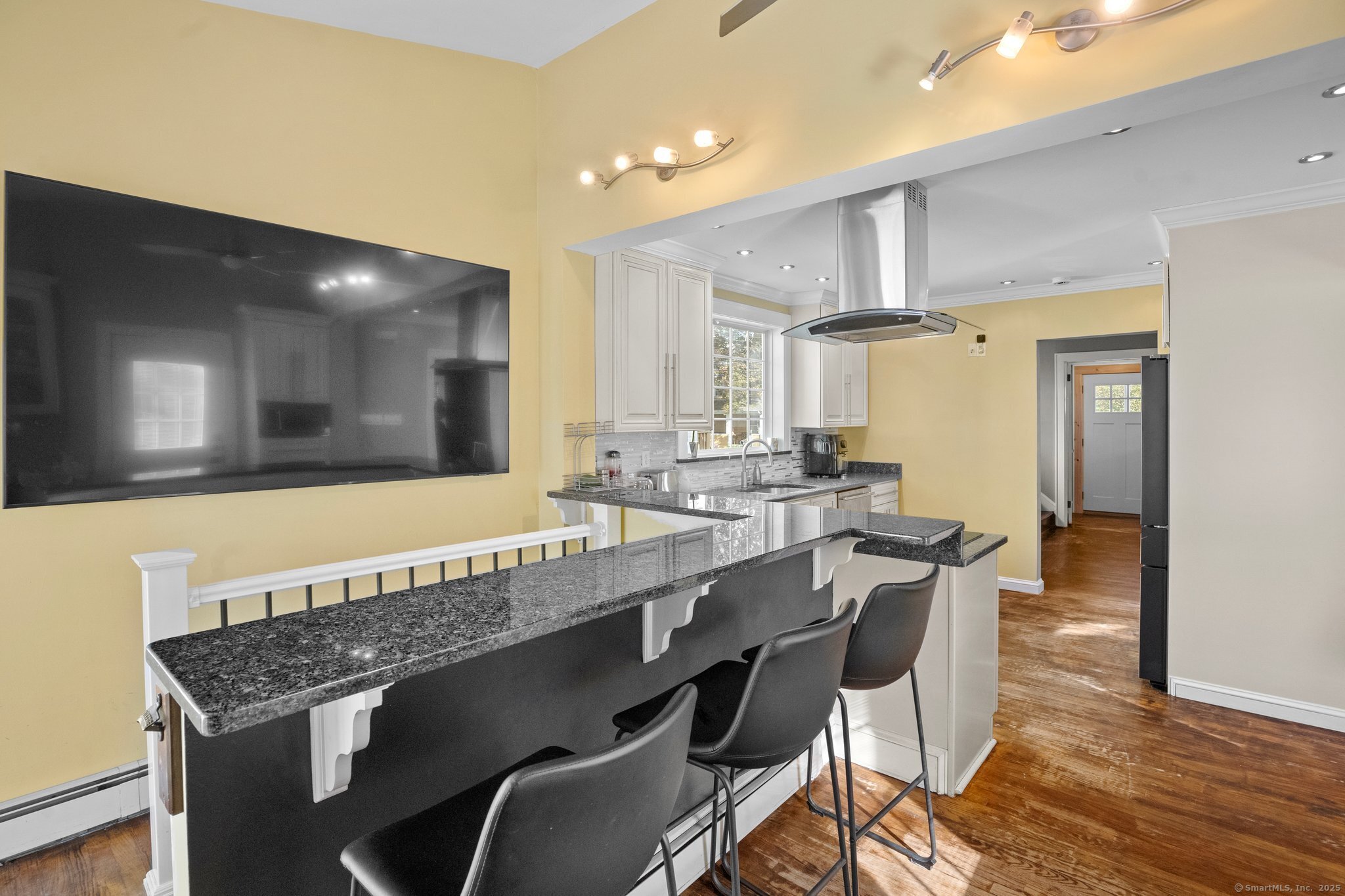 15 Overland Avenue Bridgeport, CT 06606 - Photo 30 of 35 a view of a kitchen with granite countertop a table and chairs in it