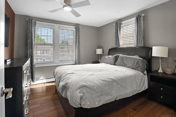a bedroom with a bed and a chair