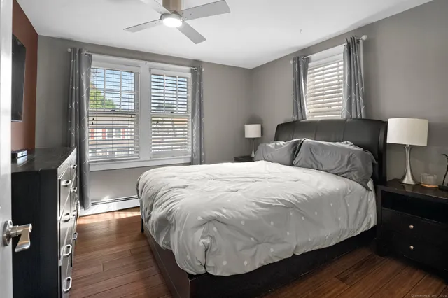 a bedroom with a bed and a chair