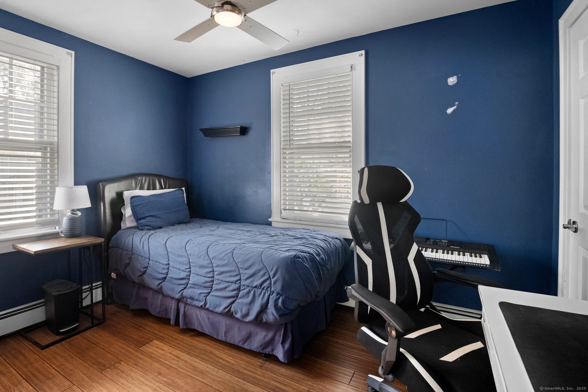 15 Overland Avenue Bridgeport, CT 06606 - Photo 33 of 35 a bedroom with a bed and a chair