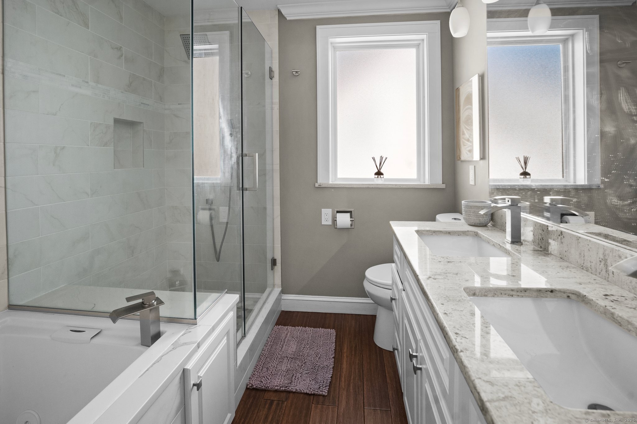 15 Overland Avenue Bridgeport, CT 06606 - Photo 35 of 35 a bathroom with a granite countertop sink mirror vanity and a bathtub