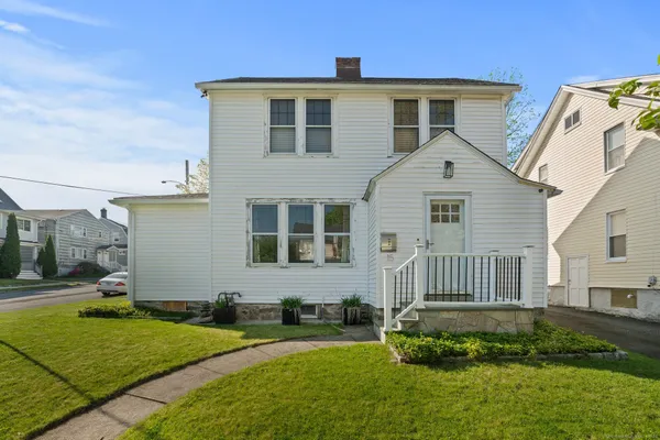 a front view of a house with a yard