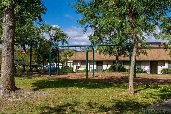 a view of a park with swings