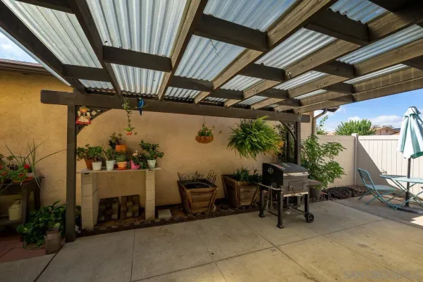 a view of a porch with furniture and a garage