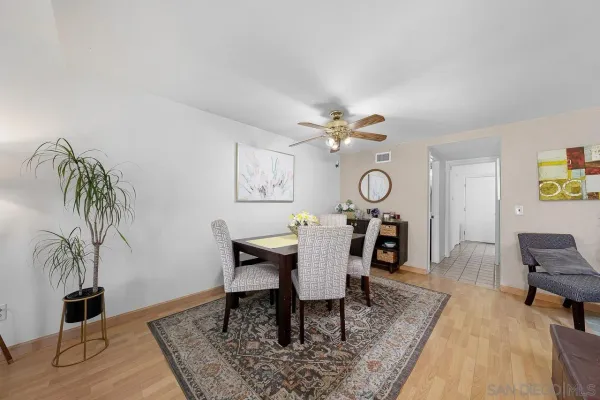 a view of a work space with furniture and wooden floor