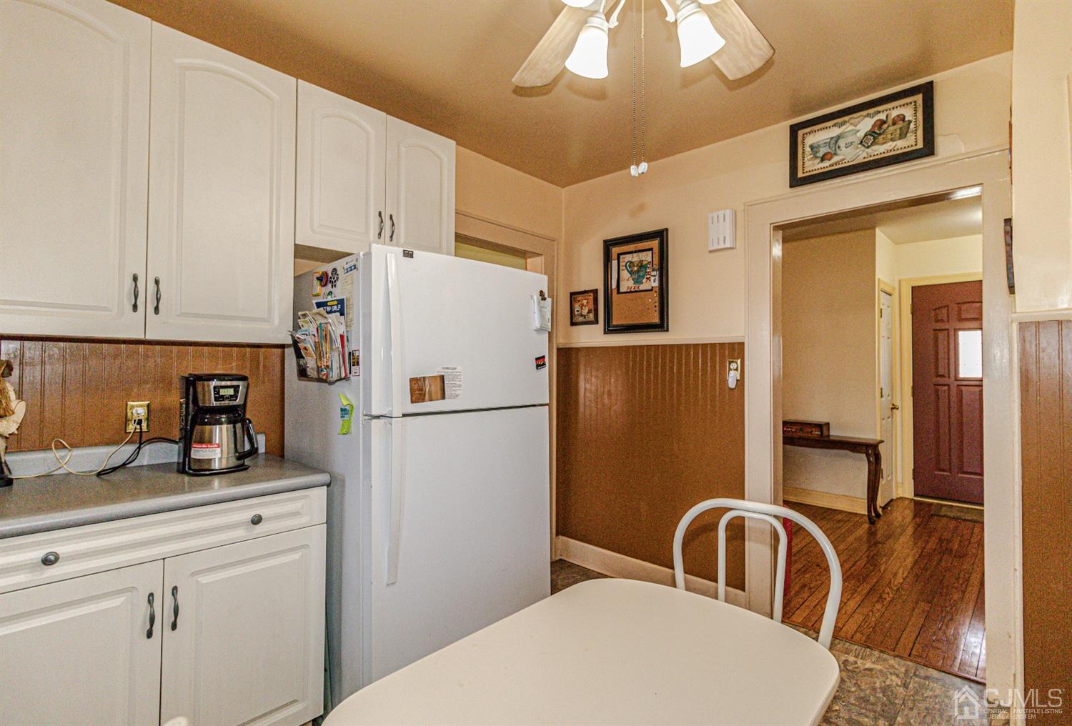 28 Meadow Road Edison, NJ 08817 - Photo 14 of 32 a white refrigerator freezer sitting inside of a kitchen