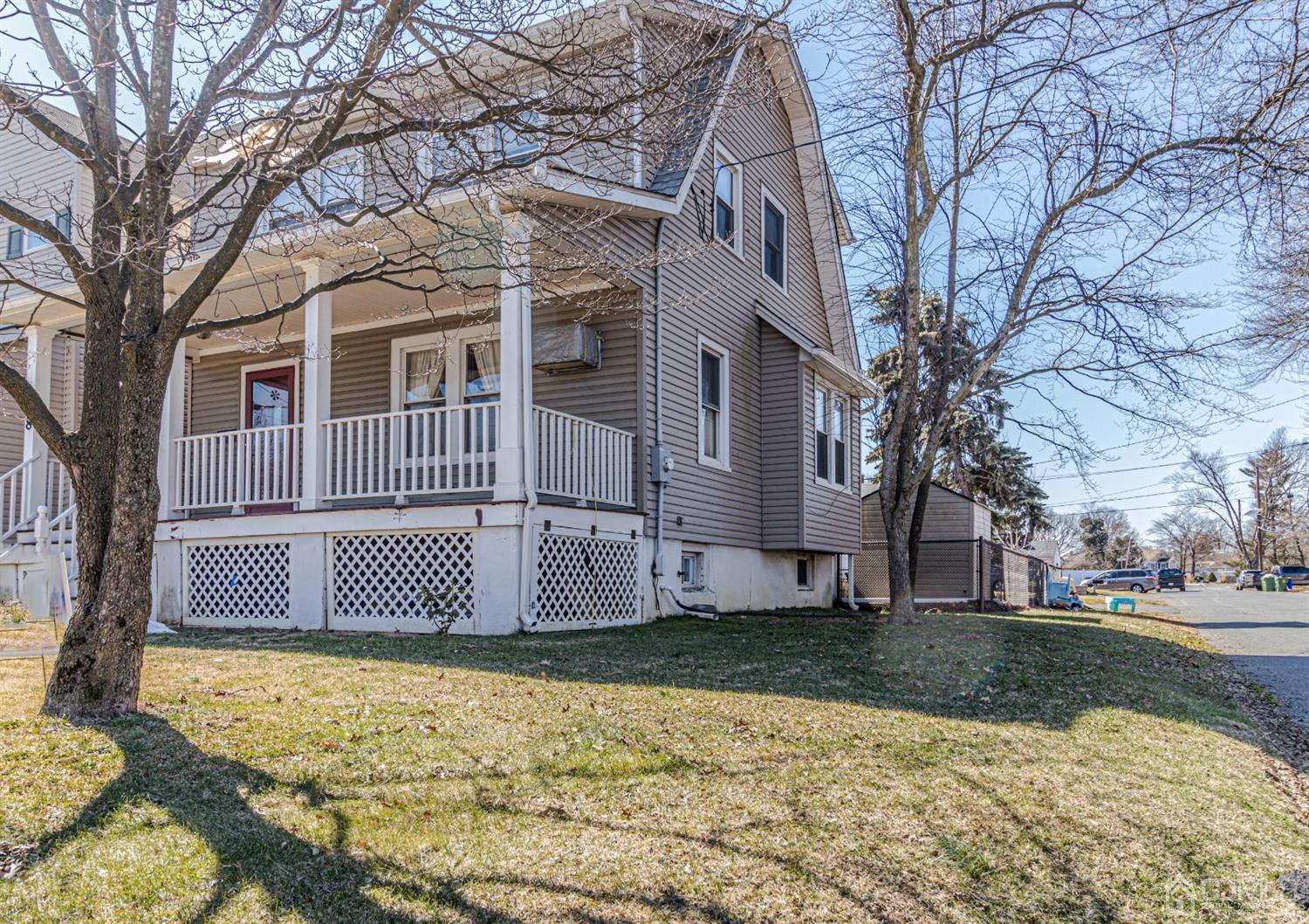 28 Meadow Road Edison, NJ 08817 - Photo 3 of 32 a front view of a house with a yard