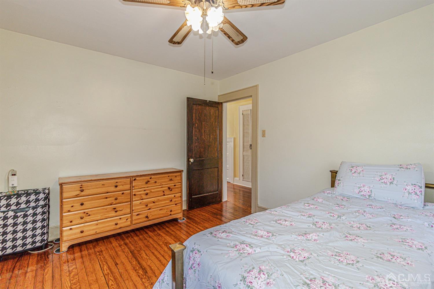 28 Meadow Road Edison, NJ 08817 - Photo 22 of 32 a bedroom with a bed and wooden floor