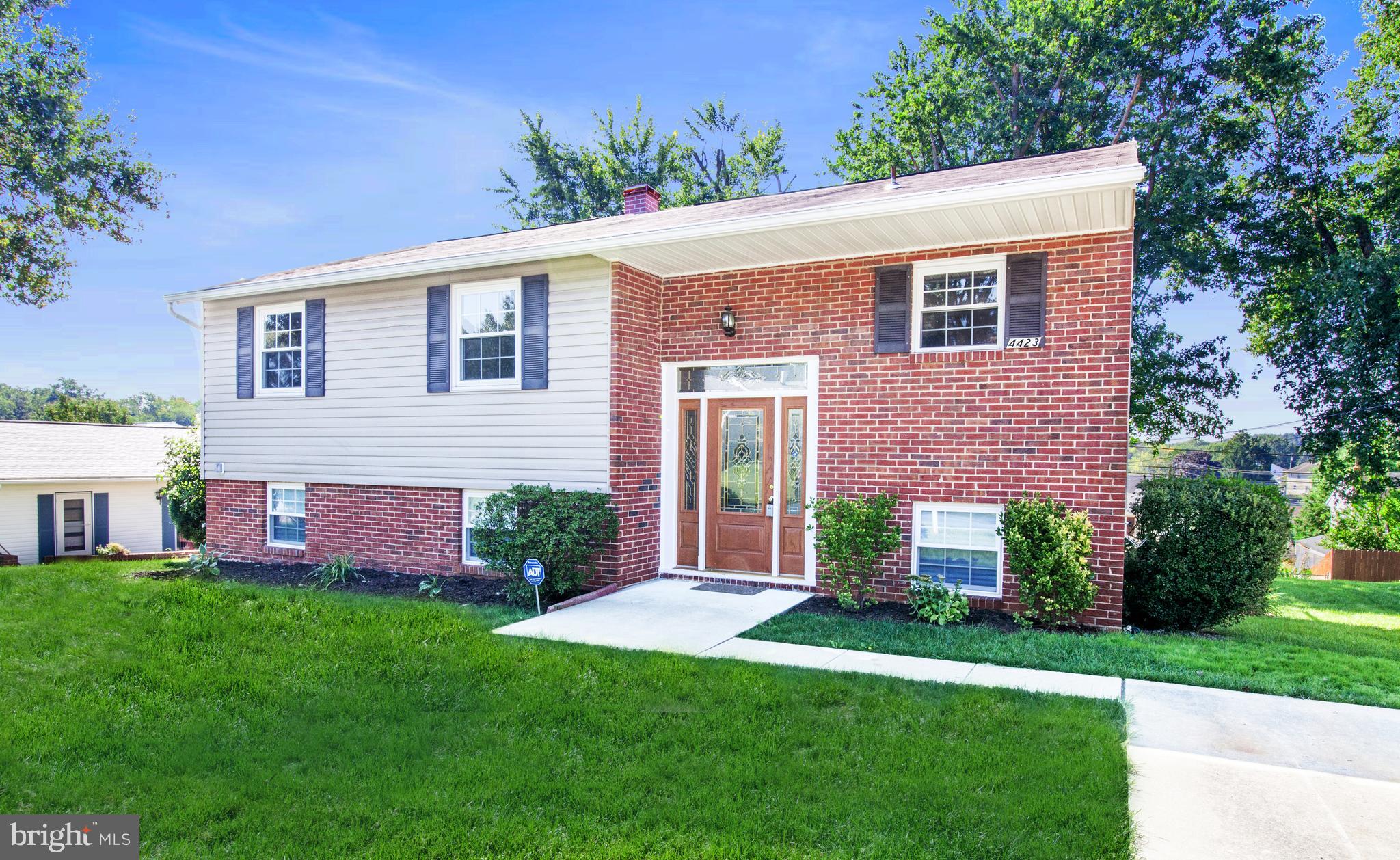 4423 Fieldgreen Road Baltimore, MD 21236 - Photo 3 of 35 a front view of a house with a yard and garage