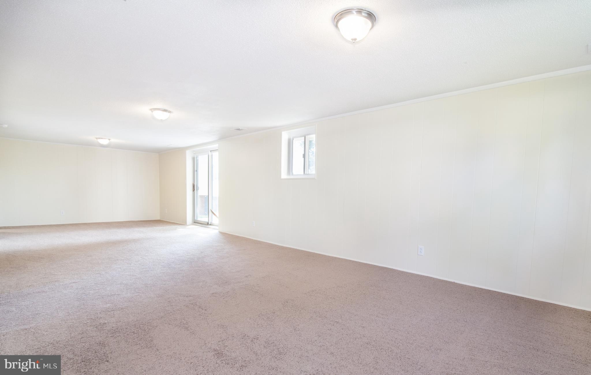 4423 Fieldgreen Road Baltimore, MD 21236 - Photo 22 of 35 a view of an empty room with a window