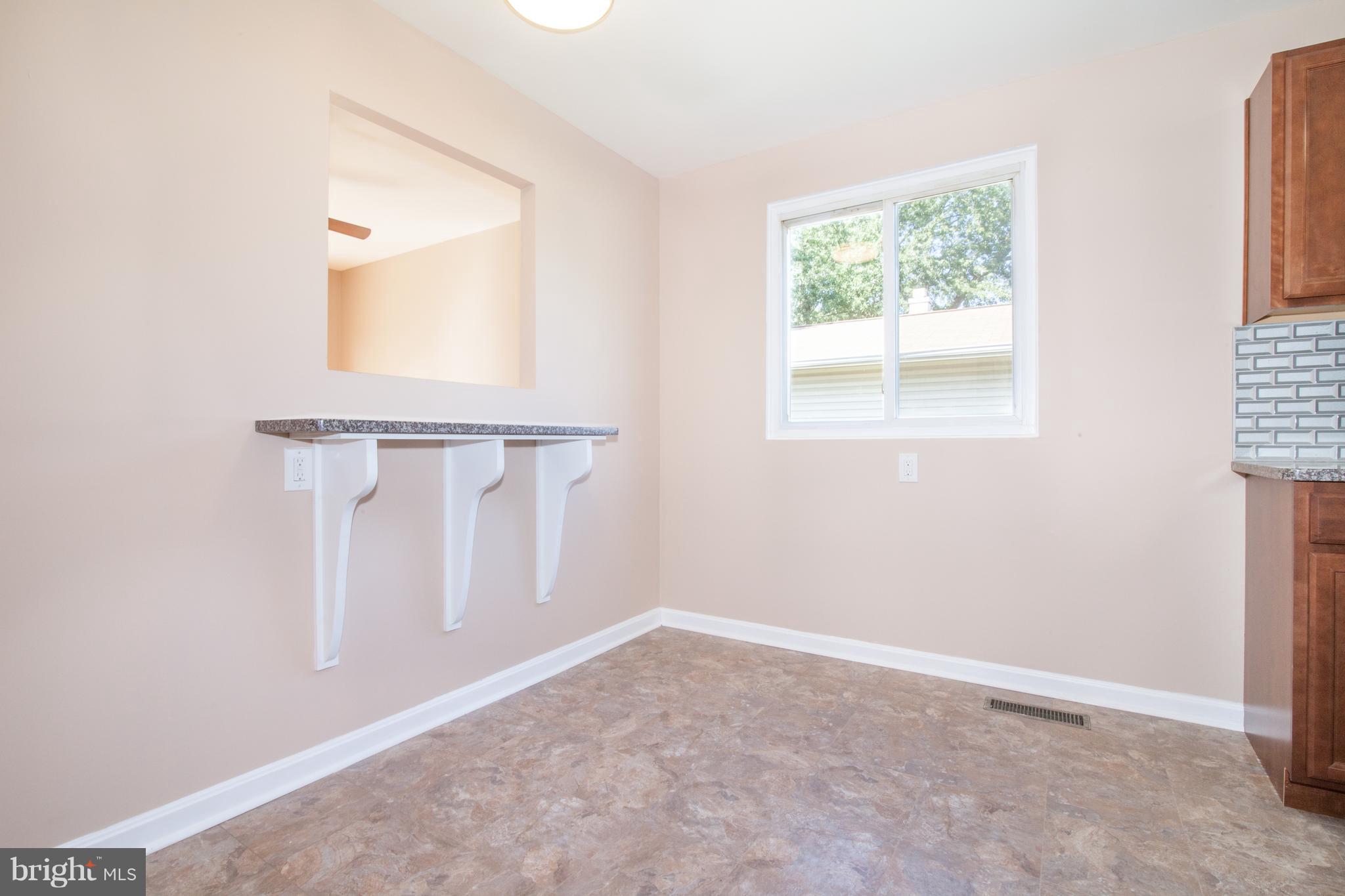 4423 Fieldgreen Road Baltimore, MD 21236 - Photo 8 of 35 an empty room with windows and closet