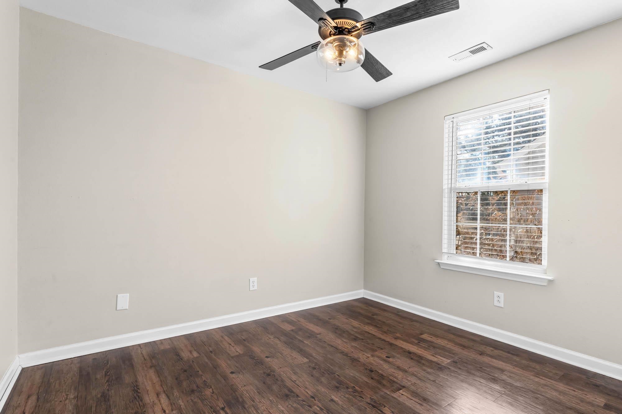 248 McKendree Lane Myrtle Beach, SC 29579 - Photo 13 of 34 Empty room featuring dark wood-style floors