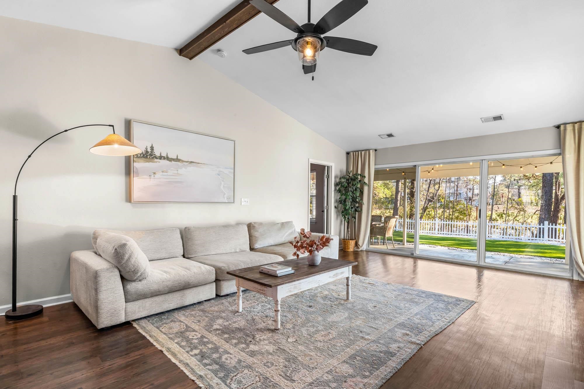 248 McKendree Lane Myrtle Beach, SC 29579 - Photo 15 of 34 Living room featuring ceiling fan, dark wood-style flooring, beamed ceiling, and high vaulted ceiling