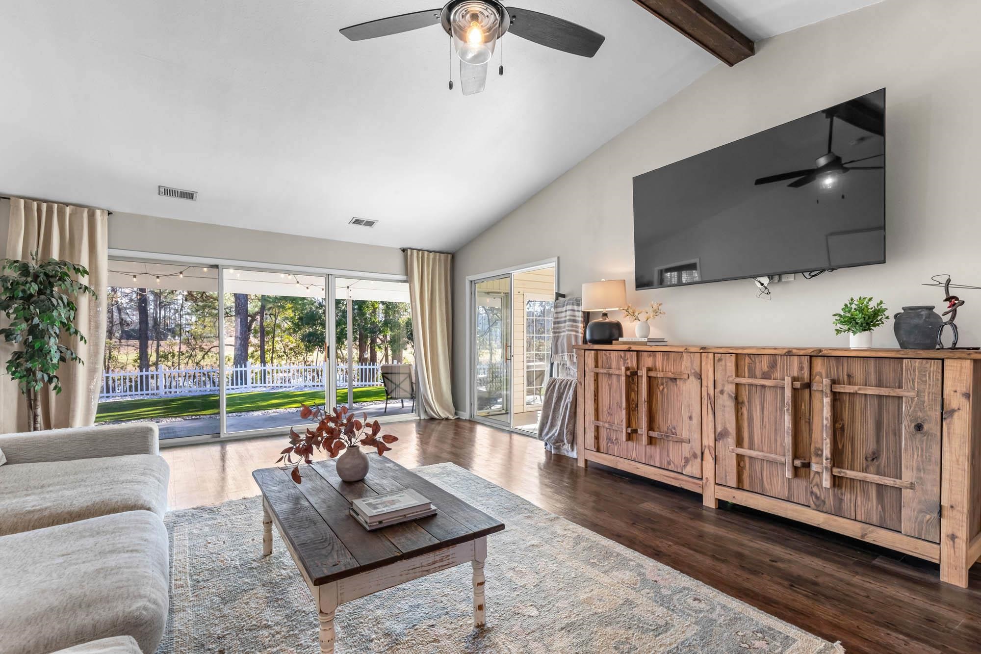 248 McKendree Lane Myrtle Beach, SC 29579 - Photo 16 of 34 Living room featuring wood finished floors, ceiling fan, beam ceiling, and high vaulted ceiling
