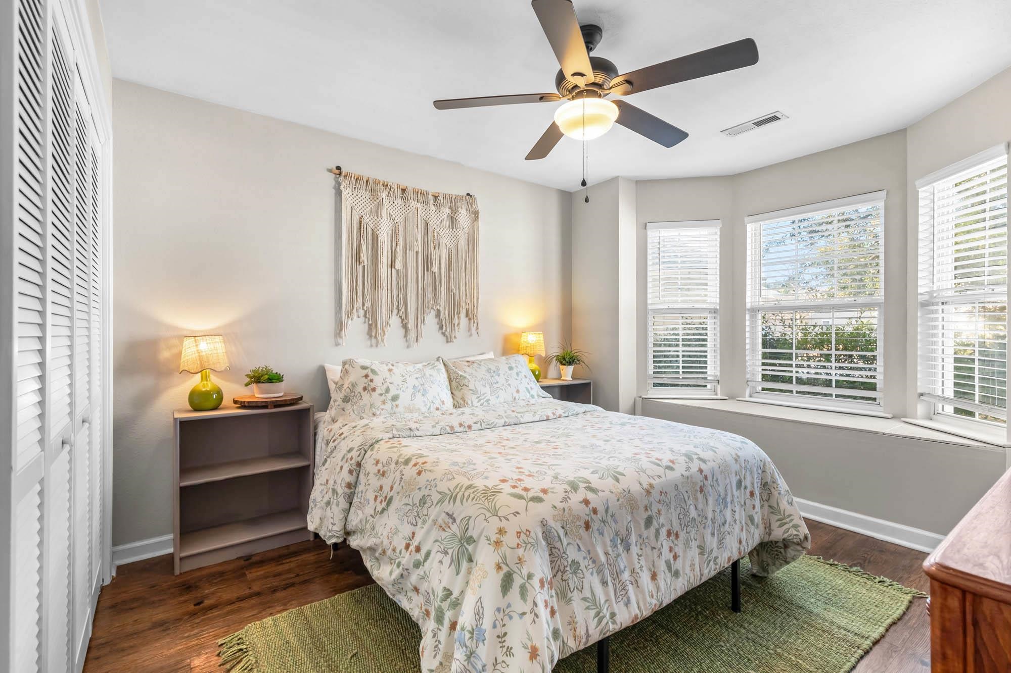 248 McKendree Lane Myrtle Beach, SC 29579 - Photo 10 of 34 Bedroom featuring a closet, dark wood-style floors, and ceiling fan