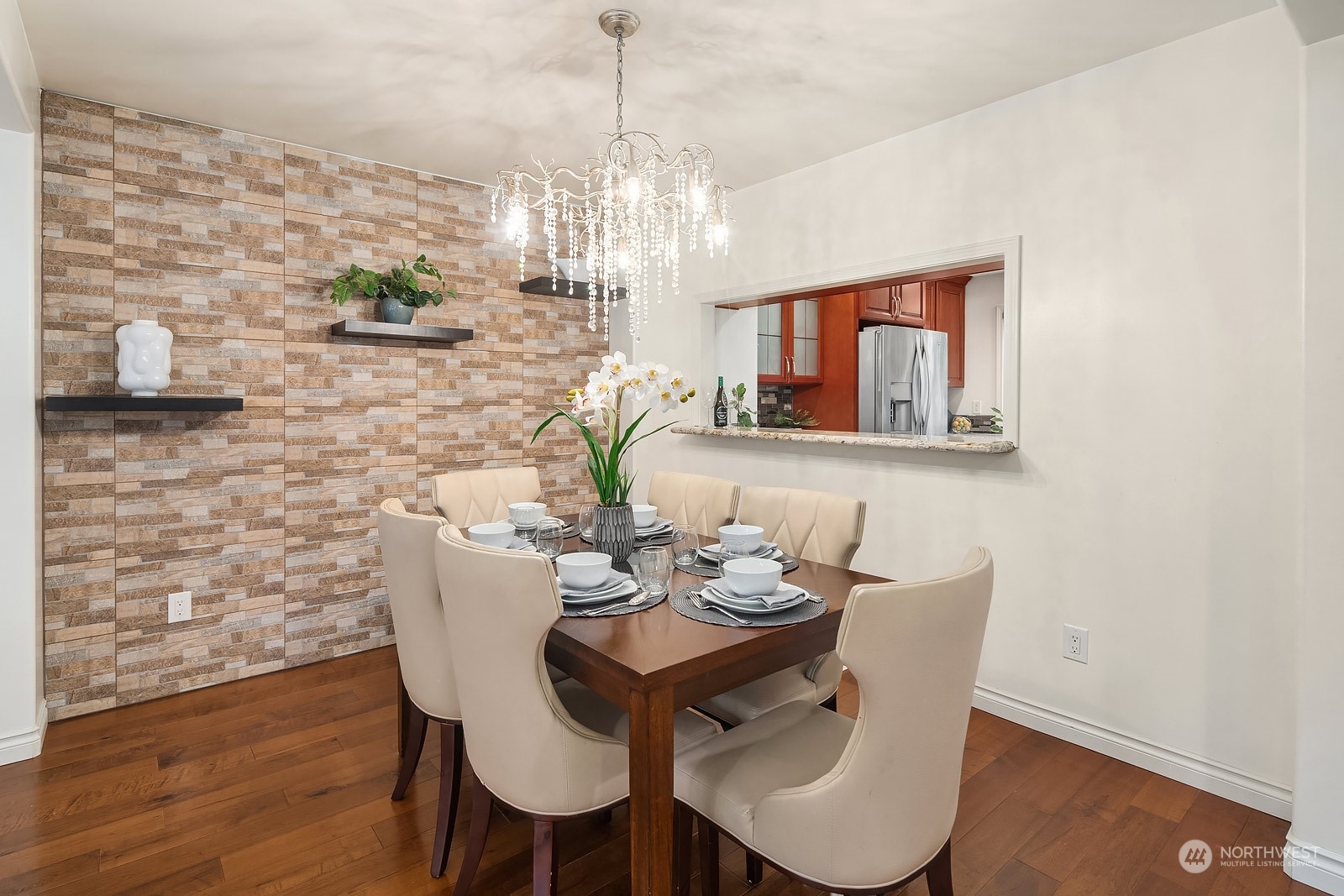 7323 Old Redmond Road, Unit 16 Redmond, WA 98052 - Photo 8 of 26 a view of a dining room with furniture wooden floor and chandelier