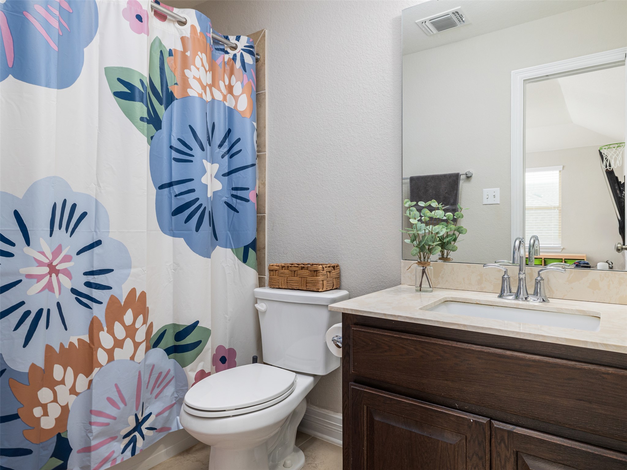 717 Blue Agave Lane Georgetown, TX 78626 - Photo 23 of 28 a bathroom with a granite countertop toilet sink and mirror