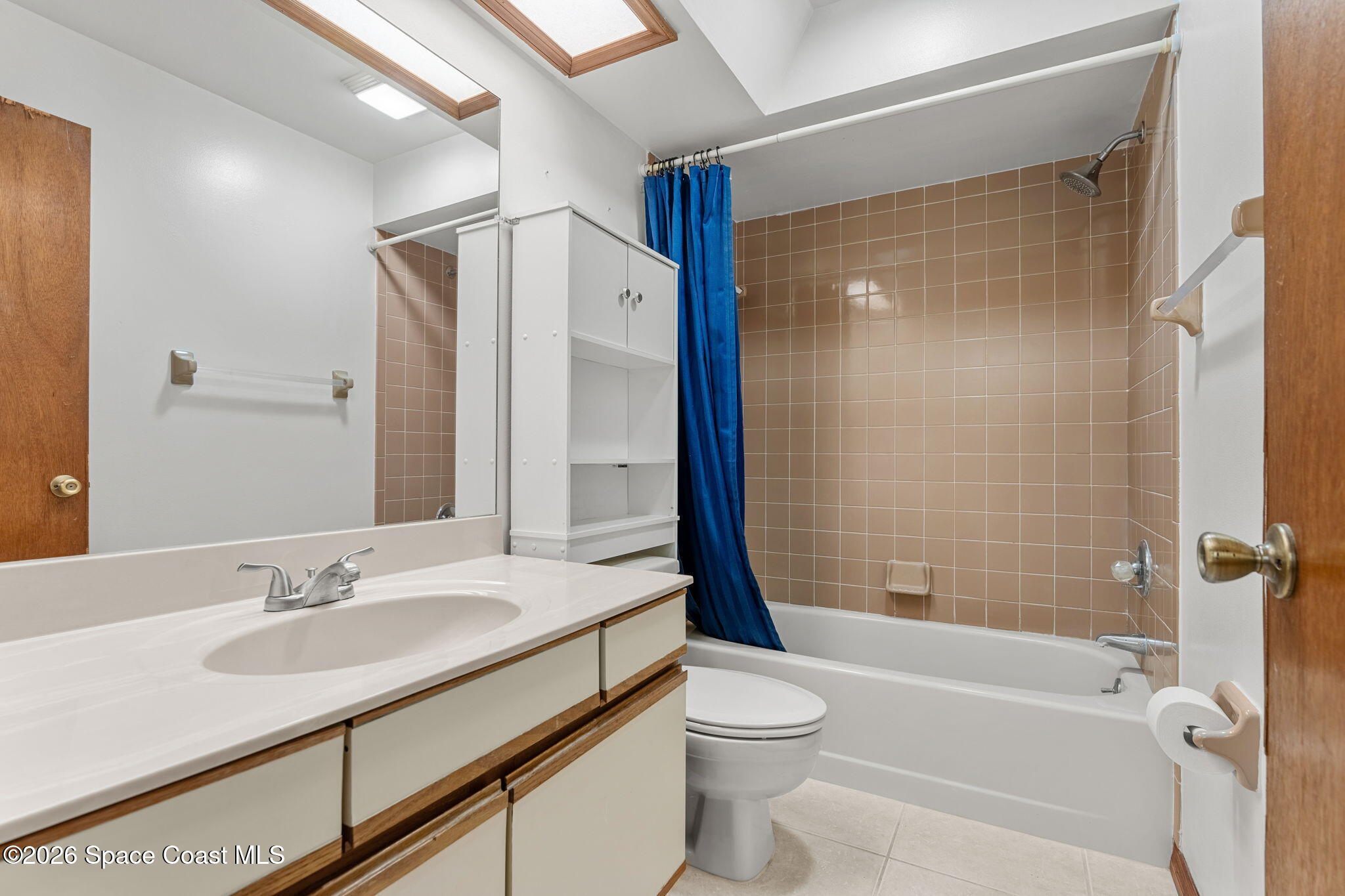 3121 Kirkland Road Northeast Palm Bay, FL 32905 - Photo 22 of 52 a bathroom with a granite countertop sink toilet and shower