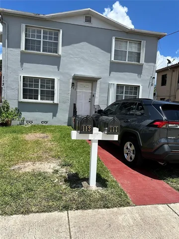 a car parked in front of a house