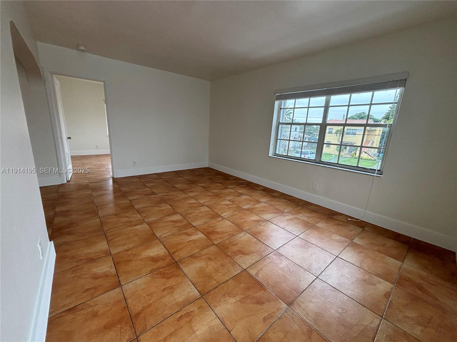 111 Southwest 31st Court, Unit 2 Miami, FL 33135 - Photo 2 of 11 a view of an empty room and window
