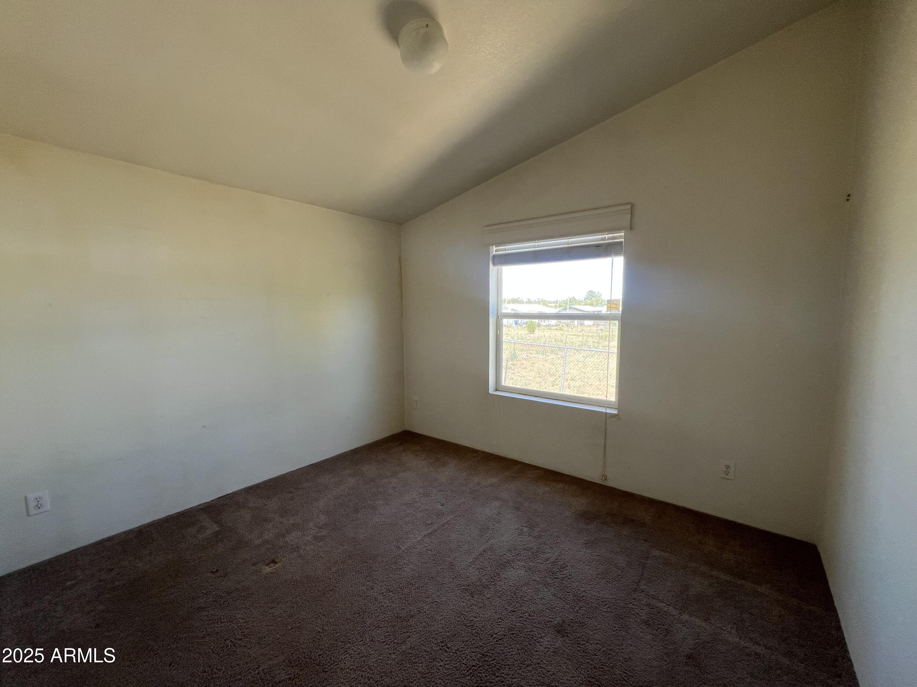 2122 Meadow Lane Overgaard, AZ 85933 - Photo 11 of 19 an empty room with a window