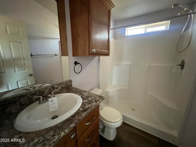 a view of a big room with closet and wooden door