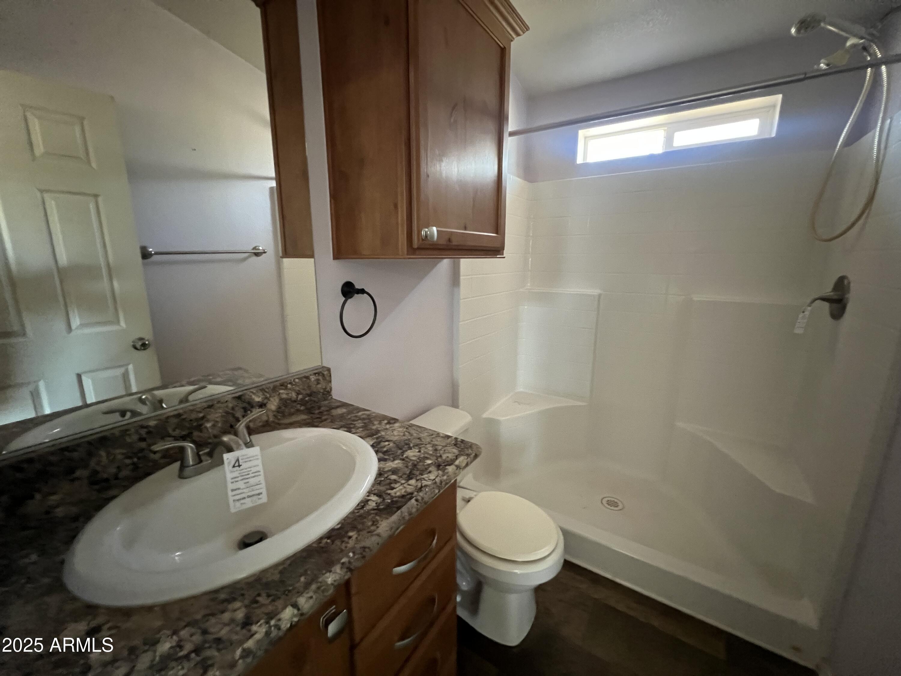 2122 Meadow Lane Overgaard, AZ 85933 - Photo 13 of 19 a bathroom with a sink toilet and shower