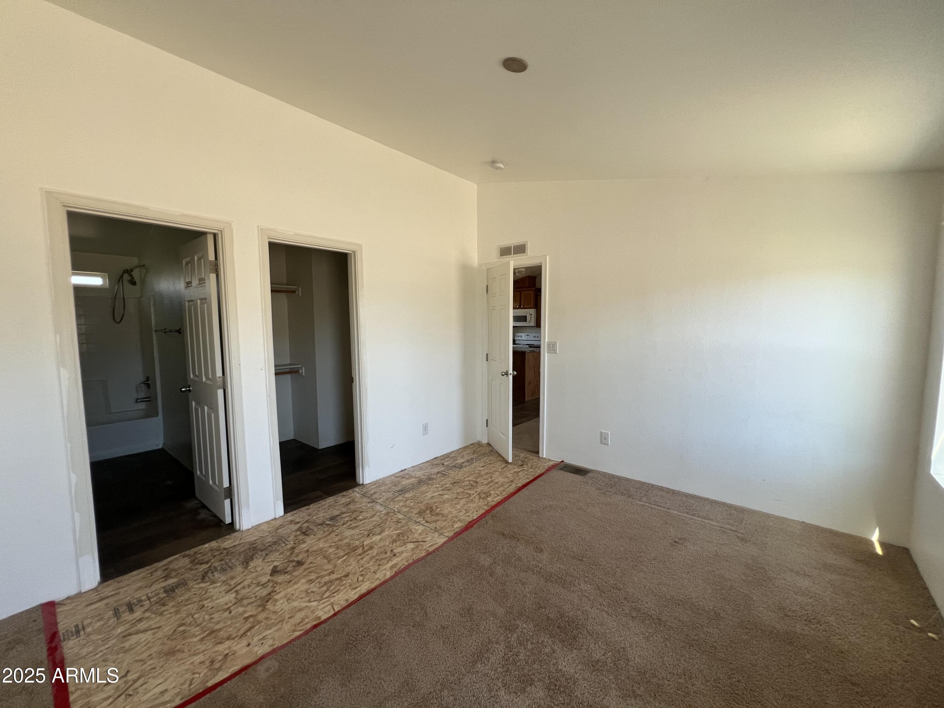 2122 Meadow Lane Overgaard, AZ 85933 - Photo 14 of 19 a view of a big room with closet and wooden door