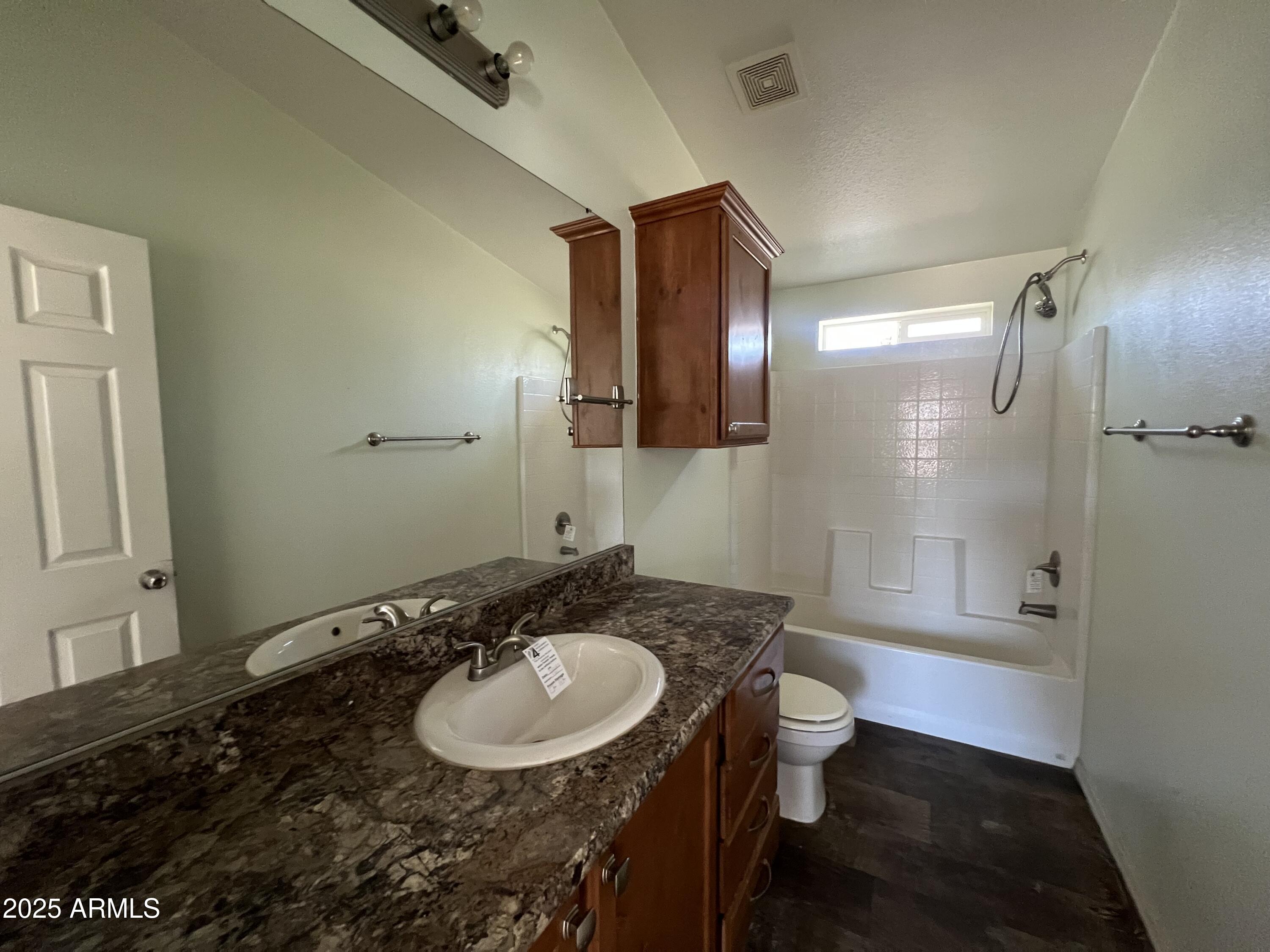 2122 Meadow Lane Overgaard, AZ 85933 - Photo 17 of 19 a bathroom with a sink and a mirror