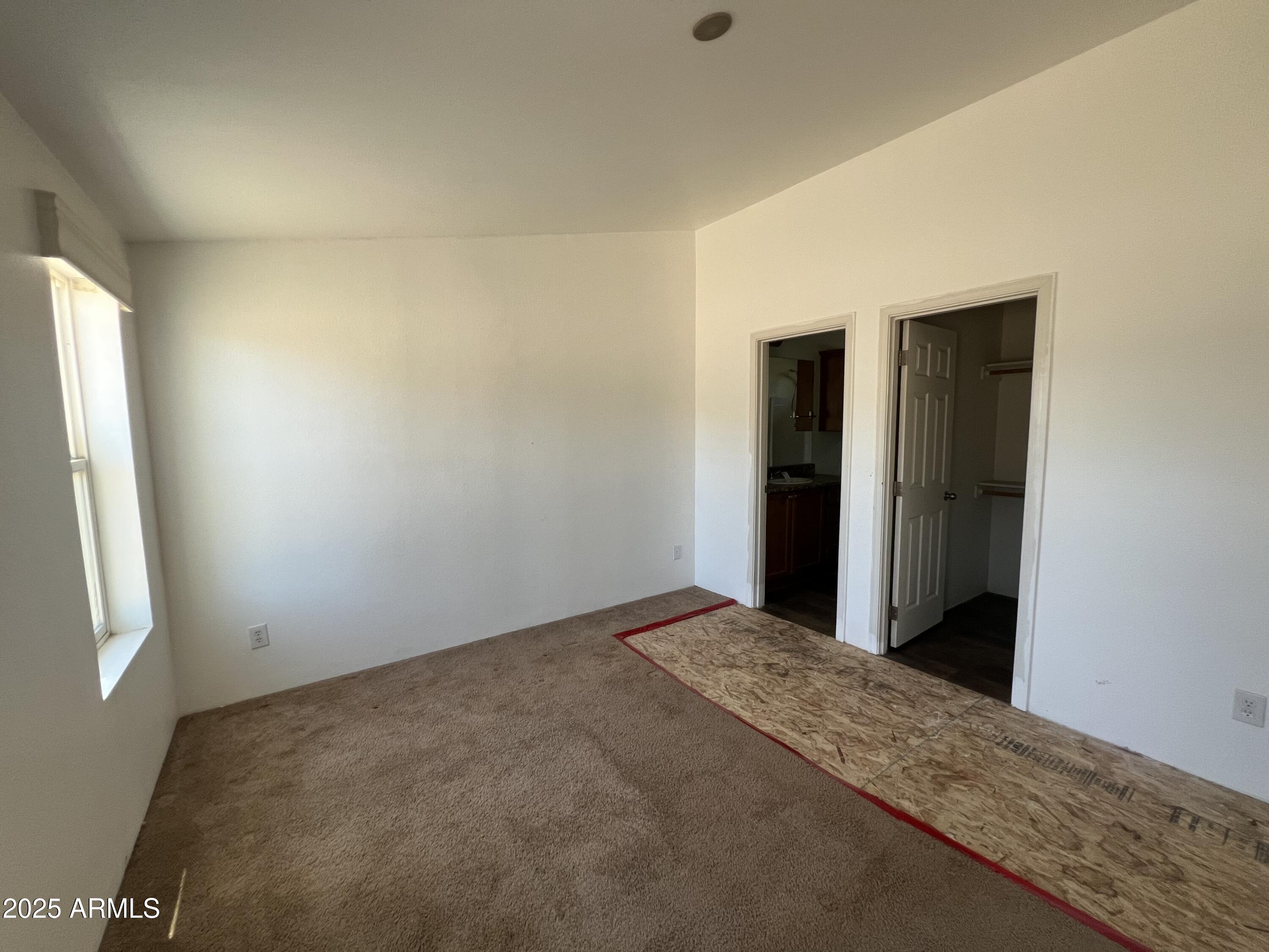 2122 Meadow Lane Overgaard, AZ 85933 - Photo 18 of 19 an empty room with windows